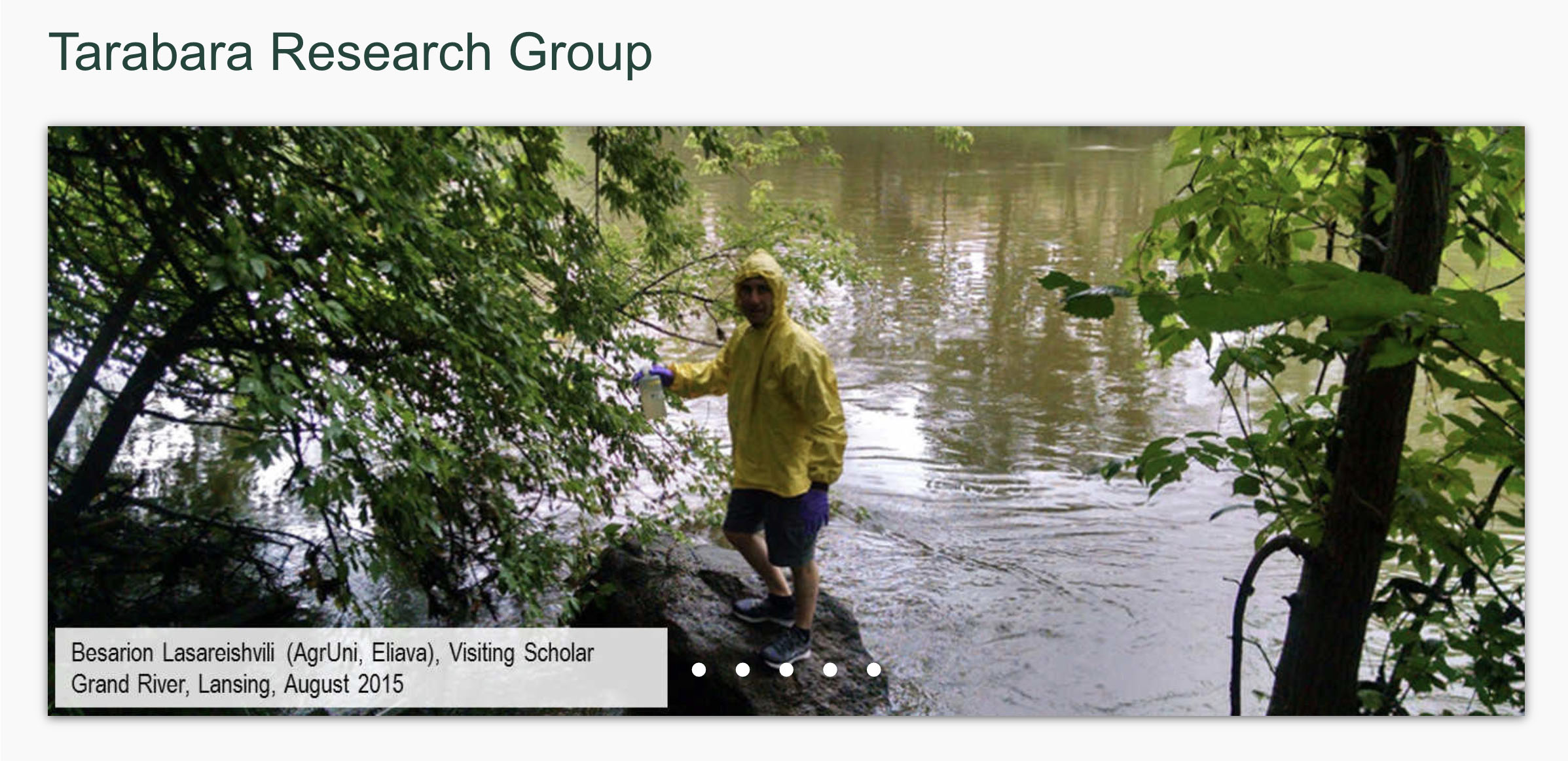 Visiting scholar taking samples from the Grand River.